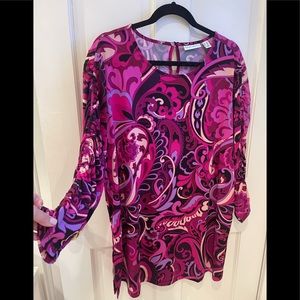 Ladies blouse with ruching on the sleeves has side bottom slit for comfort